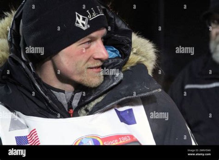 Dallas Seavey talks to officials after finishing the Iditarod Trail Sled Dog Race, March 15, 2016, in Nome, Alaska. The veteran musher had to kill a moose after it injured his dog shortly after the start of the 2024 Iditarod, race officials said Monday, March 4, 2024. (AP Photo/Mark Thiessen, File)