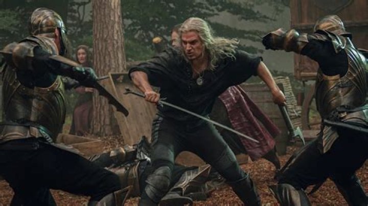 Geralt sword fighting soldiers