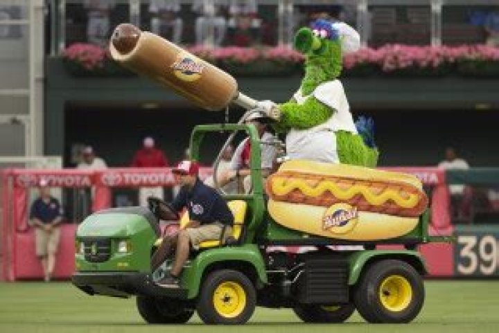 The Phillie Phanatic comes out with his Hot Dog Launcher during the fifth inning of a baseball game between the Atlanta Braves and the Philadelphia Phillies, Monday, July 4, 2016, in Philadelphia. For more than a quarter-century, Phillies fans thought dollar hot dog night was the best ballpark promotion &mdash; but the team has now decided it was the wurst. (AP Photo/Chris Szagola, File)