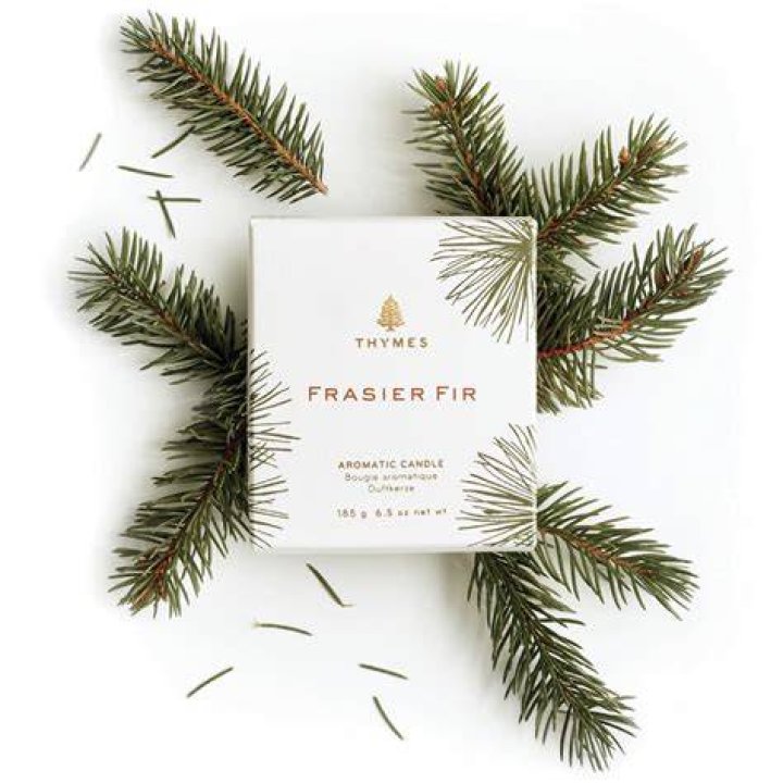 Thymes Frasier Fir Candles on coffee table