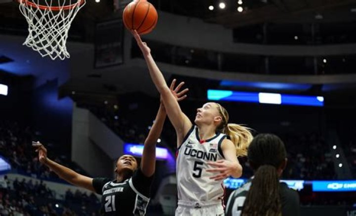 UConn star Paige Bueckers helped off the court after going down with