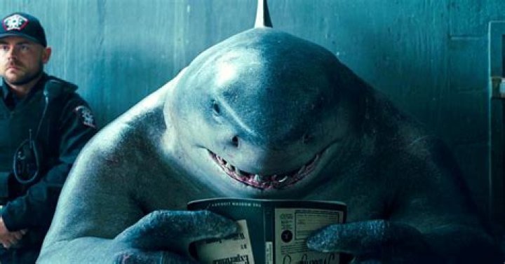 What Book Does King Shark Read Upside Down In The Suicide Squad?