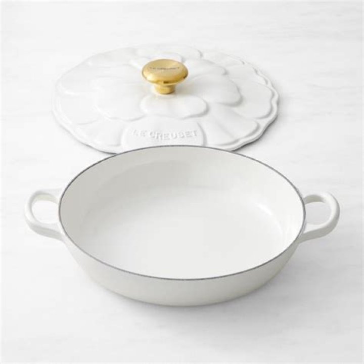 White Le Creuset Flower Petal Vase on table